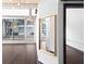 Featuring dark wood floors, a large mirror, a dark wood accent door, and glass paneled exterior doors at 660 Glen Iris Dr # 206 & 109, Atlanta, GA 30308