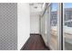 This hallway features dark wood floors, a large window, and black and white patterned wall at 660 Glen Iris Dr # 206 & 109, Atlanta, GA 30308