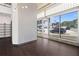 Open concept interior with hardwood floors, patterned accent wall, and large windows at 660 Glen Iris Dr # 206 & 109, Atlanta, GA 30308