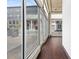 Bright interior with hardwood floors and a large storefront window offering city views at 660 Glen Iris Dr # 206 & 109, Atlanta, GA 30308
