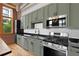 Charming kitchen with updated cabinets, stainless appliances, and black countertops at 660 Glen Iris Dr # 206 & 109, Atlanta, GA 30308