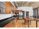Open kitchen with stainless steel appliances, wood cabinets, an island and hardwood floors at 660 Glen Iris Dr # 206 & 109, Atlanta, GA 30308