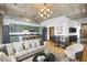 Living area with updated green kitchen, couch, and hardwood flooring at 660 Glen Iris Dr # 206 & 109, Atlanta, GA 30308