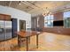 Spacious living area with large windows, hardwood flooring, and updated kitchen at 660 Glen Iris Dr # 206 & 109, Atlanta, GA 30308