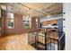 Spacious living area showcasing hardwood floors, exposed brick, and an open-concept kitchen at 660 Glen Iris Dr # 206 & 109, Atlanta, GA 30308