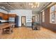 Spacious living area with updated kitchen, hardwood flooring, and large windows at 660 Glen Iris Dr # 206 & 109, Atlanta, GA 30308