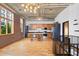 Expansive living space with a staircase, kitchen, and exposed brick at 660 Glen Iris Dr # 206 & 109, Atlanta, GA 30308