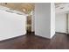 An open office space featuring a modern geometric wall design and a glimpse of the break area at 660 Glen Iris Dr # 206 & 109, Atlanta, GA 30308