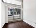 Bright room with hardwood floors and a large window offering city views at 660 Glen Iris Dr # 206 & 109, Atlanta, GA 30308