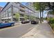 Street view of building with modern architecture and plenty of pedestrian and vehicle traffic at 660 Glen Iris Dr # 206 & 109, Atlanta, GA 30308