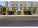 Well-maintained building exterior with stylish facade, complemented by manicured landscaping, and pedestrian access at 660 Glen Iris Dr # 206 & 109, Atlanta, GA 30308