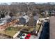 Aerial view of a residential lot with fenced yard, parking, and mature trees at 999 Washington Sw St, Atlanta, GA 30315