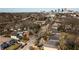 Aerial view of a residential neighborhood with mature trees and a distant city skyline at 999 Washington Sw St, Atlanta, GA 30315