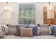 Bedroom showcasing daybed with decorative pillows under a window with macrame light fixtures at 999 Washington Sw St, Atlanta, GA 30315