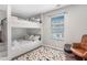 Stylized bunk beds with patterned rug, side window and decorative pillows at 999 Washington Sw St, Atlanta, GA 30315