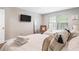 Bright bedroom featuring two beds, a television, and natural light at 999 Washington Sw St, Atlanta, GA 30315