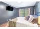 Bedroom featuring a modern television, a large window and soft decor at 999 Washington Sw St, Atlanta, GA 30315