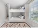 Stylish bunk bed room with patterned rug, side window and decorative pillows at 999 Washington Sw St, Atlanta, GA 30315