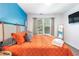 Stylish bedroom showcasing a vivid blue accent wall and natural light at 999 Washington Sw St, Atlanta, GA 30315