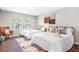 Inviting bedroom featuring two cozy beds and ample natural light from large windows at 999 Washington Sw St, Atlanta, GA 30315