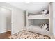 Bright bedroom featuring custom built-in bunk beds and decorative accent rug at 999 Washington Sw St, Atlanta, GA 30315