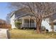 Charming two-story home featuring a cozy front porch, well-maintained landscaping, and inviting curb appeal at 999 Washington Sw St, Atlanta, GA 30315