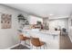 Eat-in kitchen featuring a breakfast bar, modern white cabinets, granite countertops, and stainless steel appliances at 999 Washington Sw St, Atlanta, GA 30315