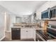 Modern kitchen with stainless steel appliances, stylish countertops, and sleek black dishwasher at 999 Washington Sw St, Atlanta, GA 30315