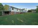 Expansive backyard with lush grass, a patio, gazebo, and a well-maintained lawn at 1001 Wiley Bridge Rd, Woodstock, GA 30188
