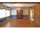 Elegant dining room with hardwood floors, wood trim, and a classic chandelier at 1001 Wiley Bridge Rd, Woodstock, GA 30188