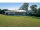 Beautiful ranch-style home featuring a metal roof, stone accents, and a spacious front yard at 1001 Wiley Bridge Rd, Woodstock, GA 30188