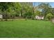 Extensive backyard features lush greenery, mature trees, and a fence at 1796 Center Ave, East Point, GA 30344