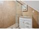 Bathroom with a single sink vanity and a glass enclosed shower at 1796 Center Ave, East Point, GA 30344