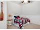 Bright bedroom space featuring ceiling fan and nautical themed decor at 1796 Center Ave, East Point, GA 30344