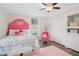 Cozy bedroom decorated with pink accents, a fluffy rug and natural light provides a welcoming space at 1796 Center Ave, East Point, GA 30344