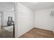 Bright room with white walls and wood floors, offers versatile space for bedroom or sitting area at 1796 Center Ave, East Point, GA 30344