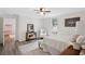 Light-filled bedroom with neutral walls, a queen bed and wood flooring providing a serene atmosphere at 1796 Center Ave, East Point, GA 30344