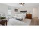 Bright bedroom featuring a queen bed, dark furniture, and a patterned rug creating a cozy retreat at 1796 Center Ave, East Point, GA 30344