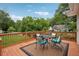 Inviting deck area with outdoor seating and views of the well manicured backyard at 1796 Center Ave, East Point, GA 30344