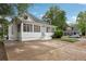 Classic home with a screened porch and a well-maintained lawn, offering a welcoming curb appeal at 1796 Center Ave, East Point, GA 30344