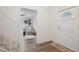 Well-lit foyer with hardwood floors, connecting to a cozy living room and featuring a front door at 1796 Center Ave, East Point, GA 30344