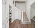 Bright foyer with a staircase and hardwood floors, creating a welcoming entrance to the home at 1796 Center Ave, East Point, GA 30344