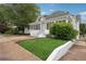 Charming home with a well-manicured lawn and a screened-in front porch, perfect for relaxing outdoors at 1796 Center Ave, East Point, GA 30344
