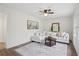 Comfortable living room featuring wood paneling and a textured accent wall at 1796 Center Ave, East Point, GA 30344