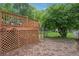 Backyard brick patio area with view of the deck and green space at 1796 Center Ave, East Point, GA 30344