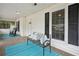 Cozy screened porch with comfortable seating, perfect for enjoying the outdoors in any weather at 1796 Center Ave, East Point, GA 30344