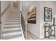 Inviting stairway and entry with wood floors, neutral paint, and modern decor at 208 Maycrest Path, Tucker, GA 30084