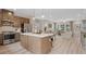 Open concept kitchen with stainless steel appliances and a spacious island at 208 Maycrest Path, Tucker, GA 30084