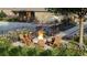 Close up of community pool with lounge area and fire pit seating at 208 Maycrest Path, Tucker, GA 30084