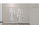 Clean and spacious walk-in closet with carpet and hanging rods for optimal storage at 208 Maycrest Path, Tucker, GA 30084